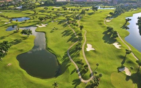 aerial view of a green golf course 