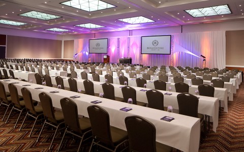 a ballroom set up for a conference 