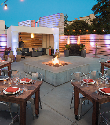out door table setting around a fire place