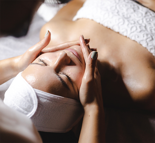 woman laying down getting a facial