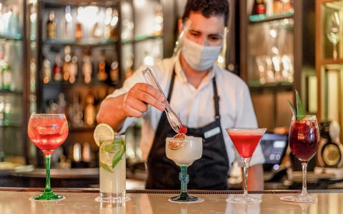 bartender preparing various cocktails