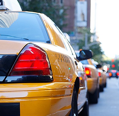 Close up of a New York City Taxi in traffic 