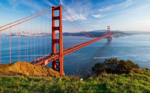 the red Golden Gate Bridge over a body of water