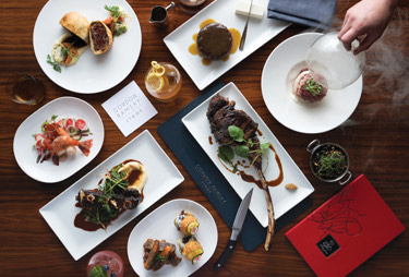 Aerial view of mixed foods served on white plates.