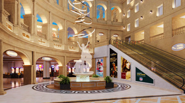 A large white sculpture in the middle of a large entrance.