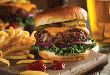 Cheeseburger with french fries and a pint of beer.