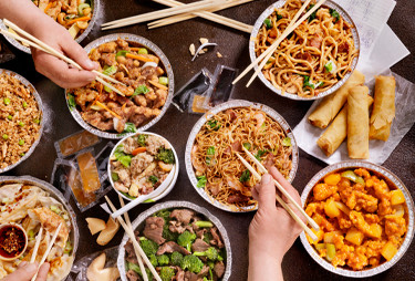 Aerial view of bowls of asian inspired dishes.