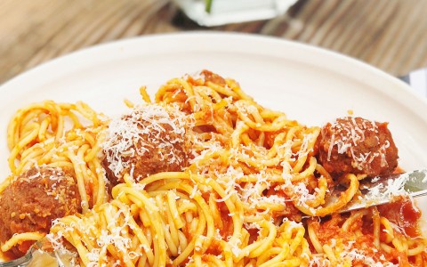 tasty bolognese pasta with some parmesan on the top 