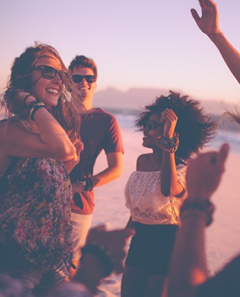 A group of friends celebrating at the beach