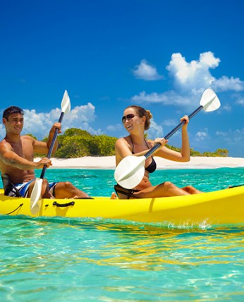 A happy couple doing kayak on a sunny day