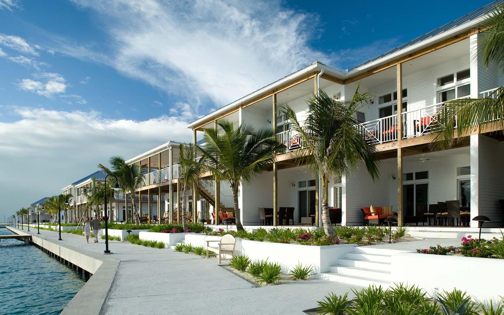 General view of the Villas area, with lots of palm trees and located next to the sea