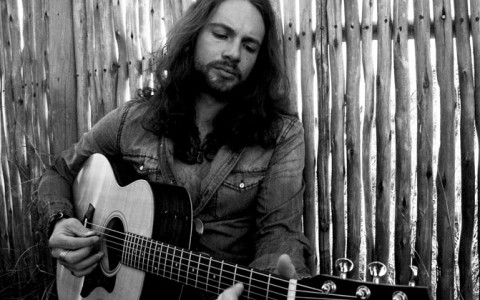 black and white vern daysel holding guitar
