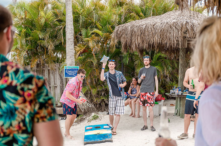 people playing games at the beach