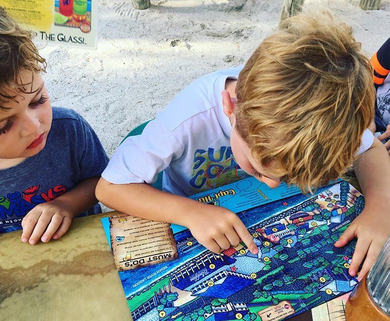 child playing games at beach