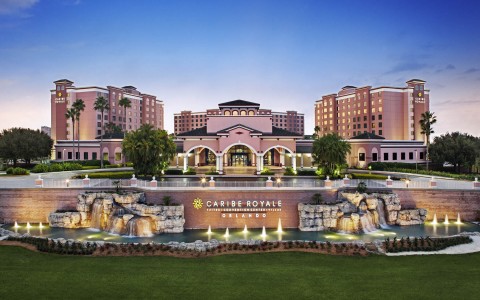 exterior entrance of Caribe Royal Resort with water features