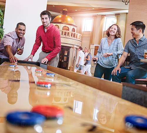 people playing shuffleboard
