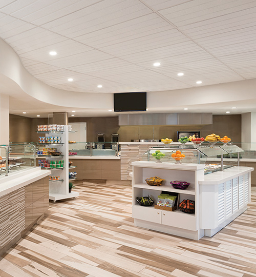 buffet area with fruits and snacks around it