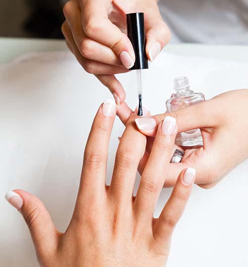 person getting their nails painted