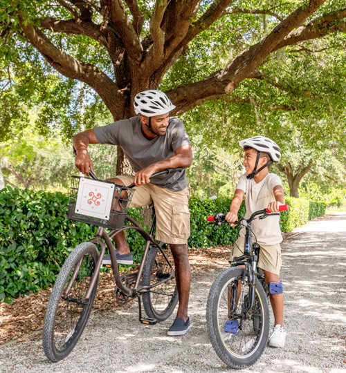 father and son riding bikes