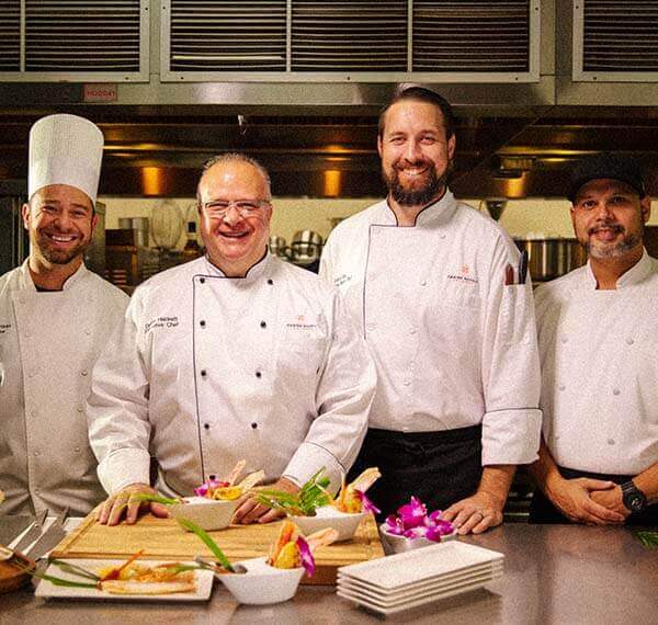 chef team smiling in the kitchen