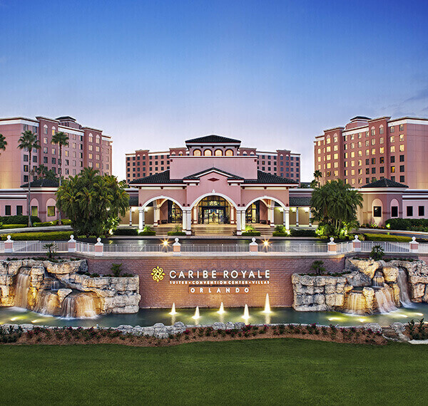 caribe royal entrance with fountains in front of the buildings