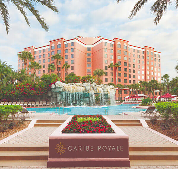 caribe royale entry with a pool and the buildings in the background