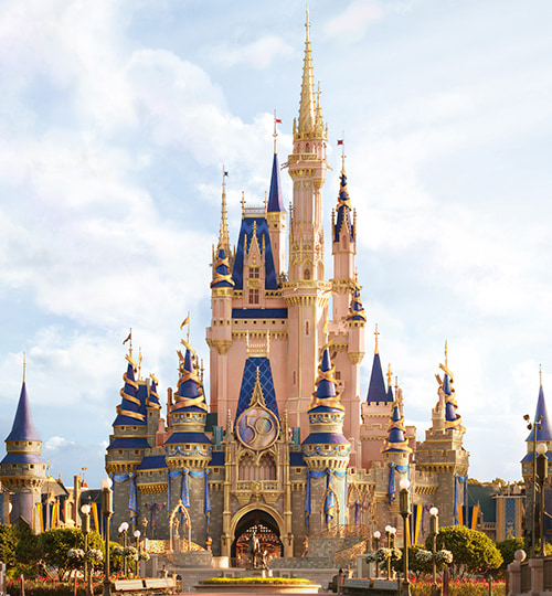 view of disney magic kingdom castle in a sunny day