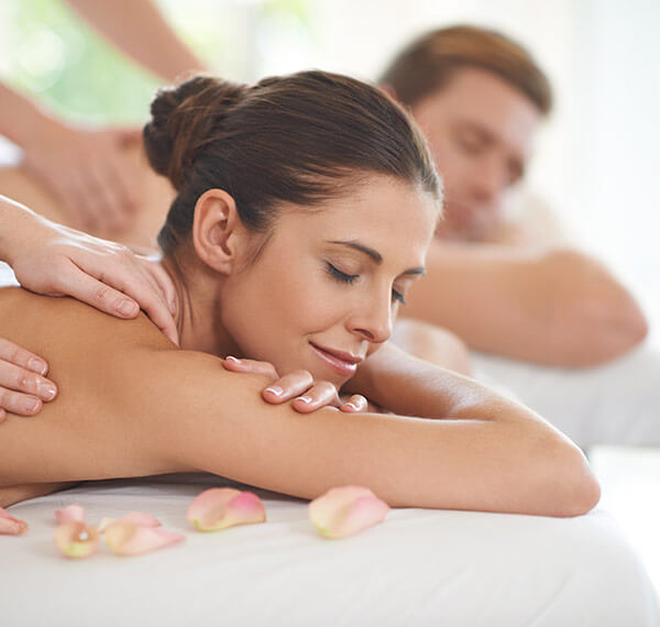 man and woman getting a massage