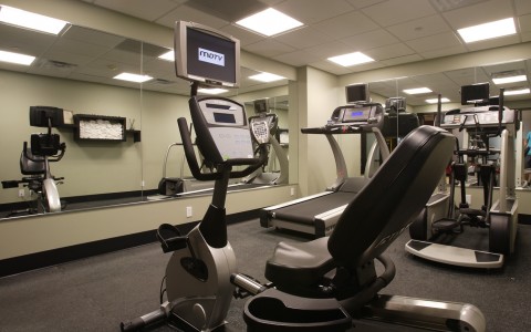 fitness room with a few machines