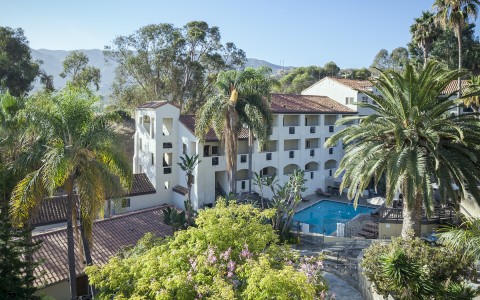 aerial view of the Catalina Canyon hotel surrounded by tropical palm trees