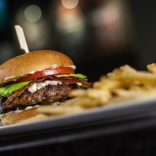 a hamburger and fries on a plate