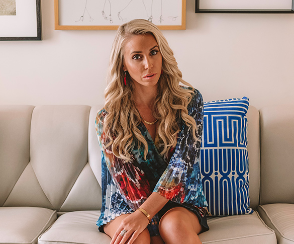 blonde lady sitting on couch