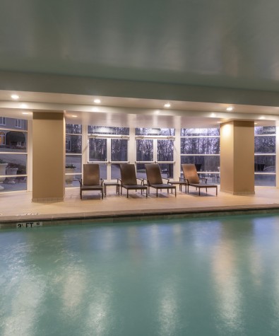 indoor pool and four lounge chairs