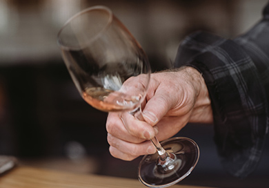 person holding a wine glass on a tilt