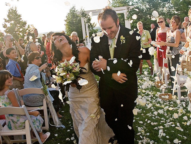 view of a newlywed couple walking down the isle