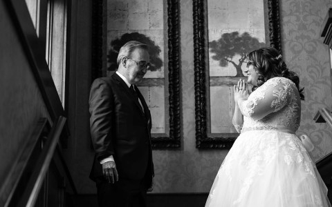 black and white photo of father seeing the bride