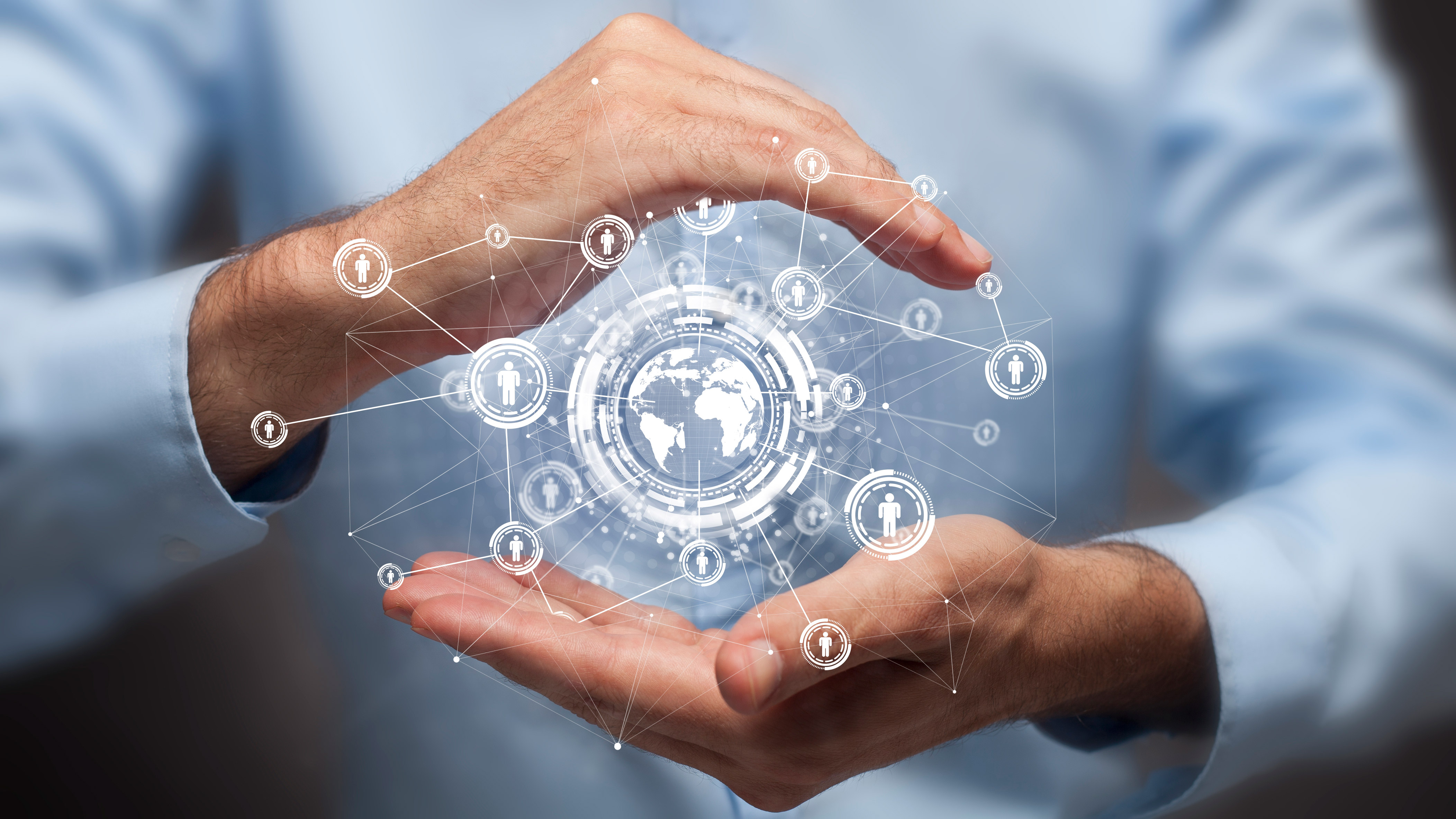 Businessman holding in hand a global connection communications concept