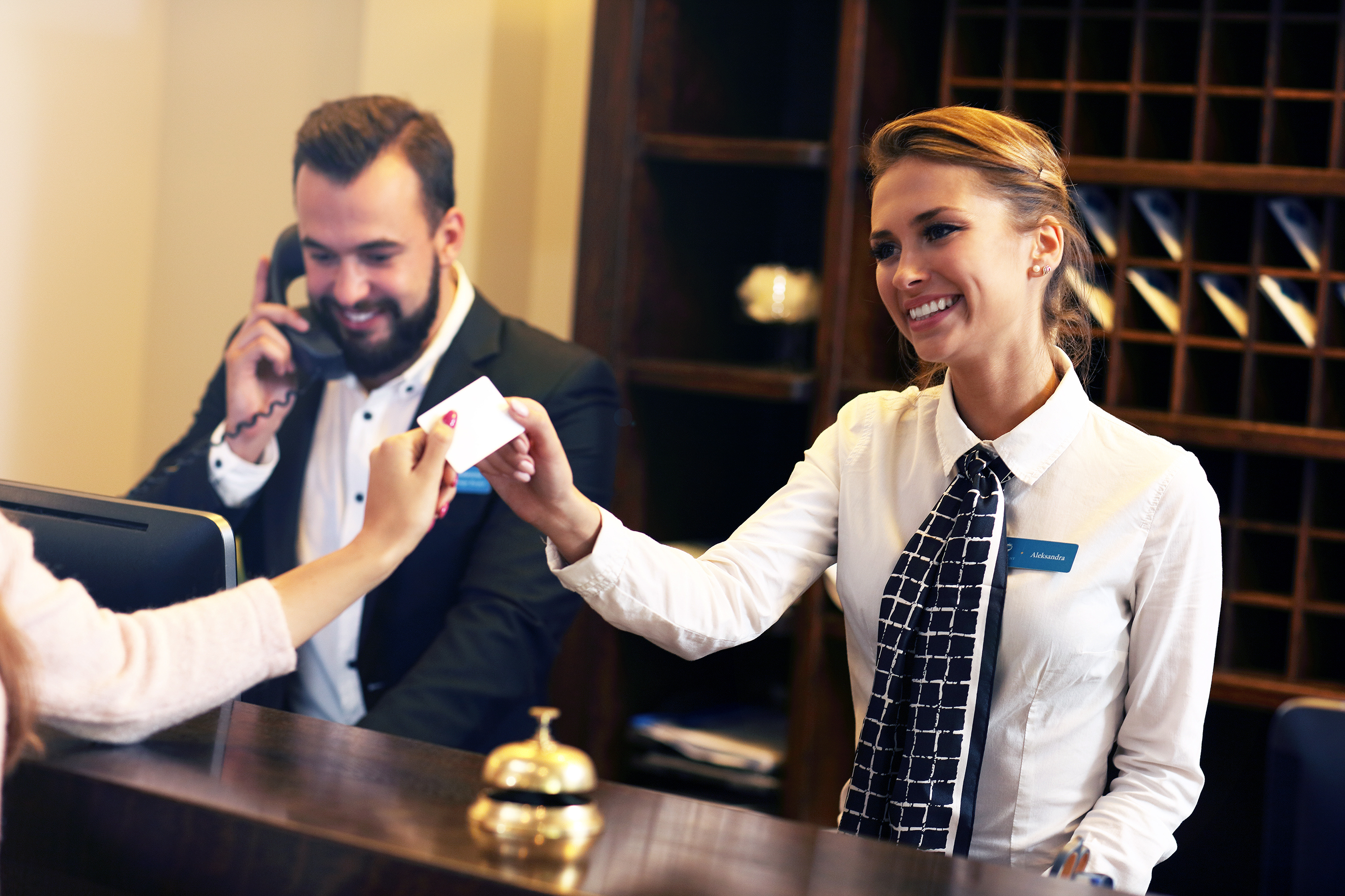 Guests getting key card in hotel