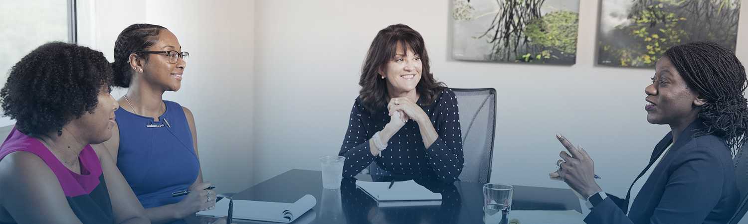 a woman talking to employees