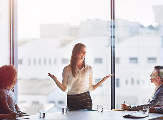 a woman talking during a business meeting