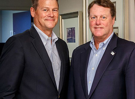 two business men smiling