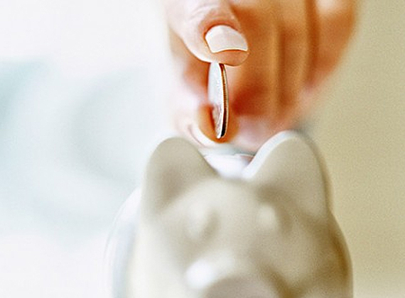 a woman holding a quarter