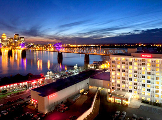 the exterior of a hotel at night