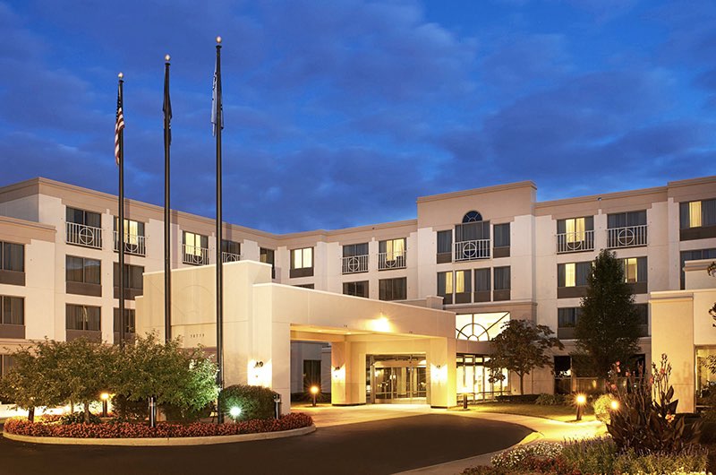the exterior of a business hotel at night