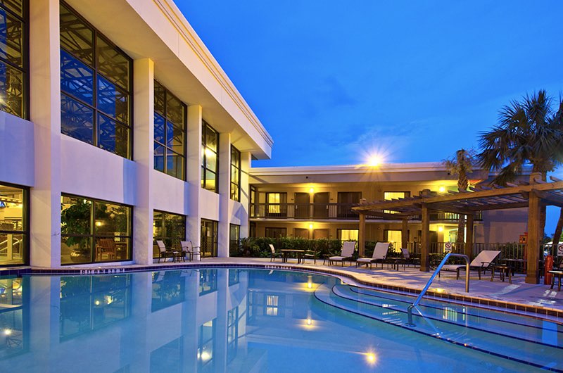 the pool area at a hotel