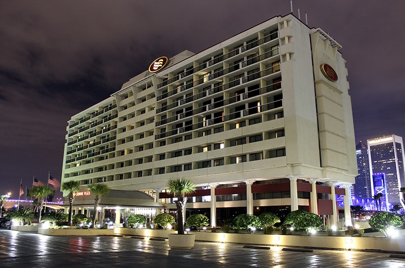 the exterior of a hotel at night