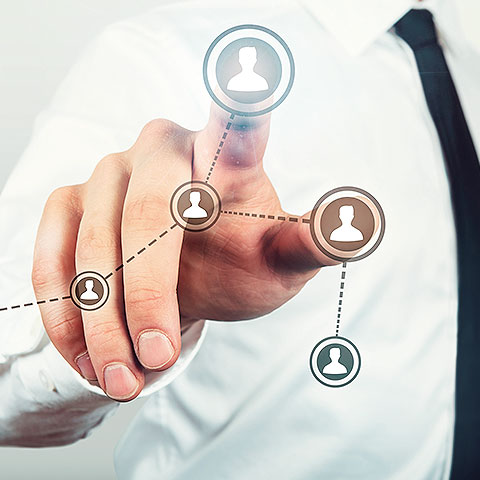 a man pointing to icons on a screen