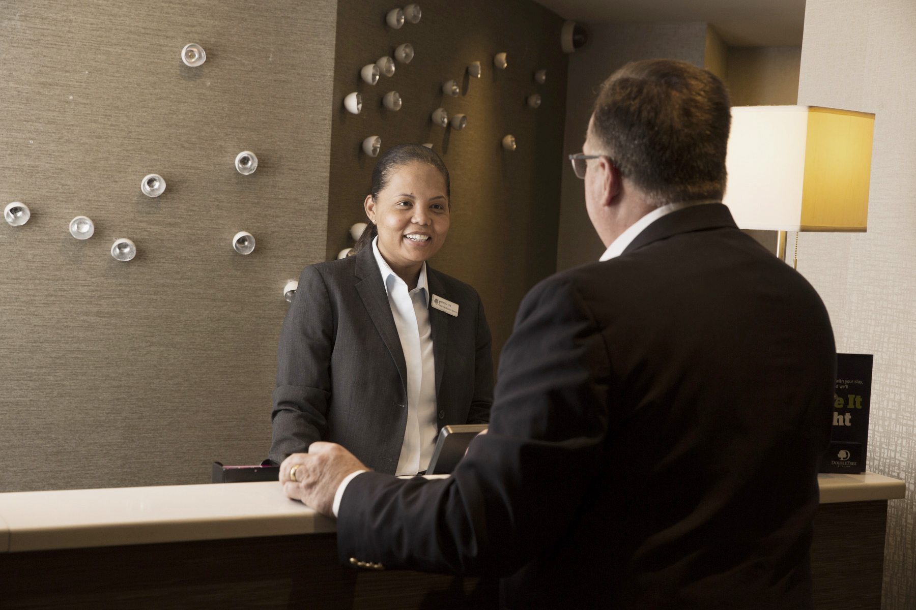 a man checking into a hotel