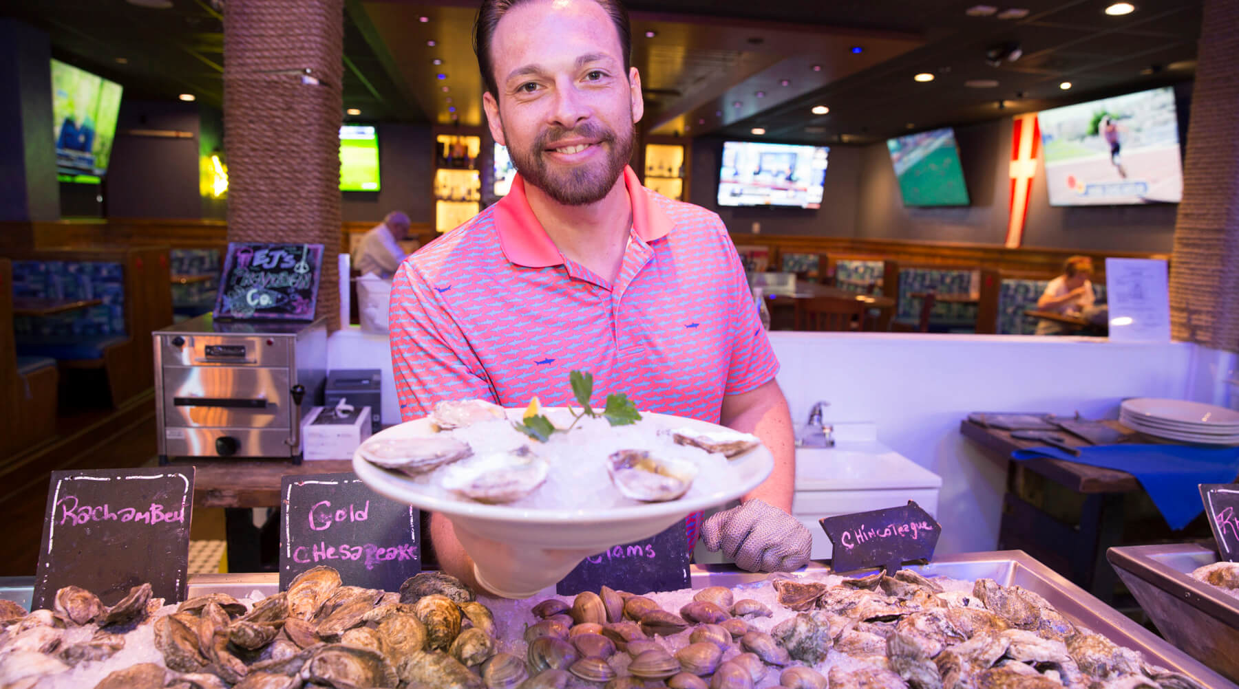 a man serving oysters