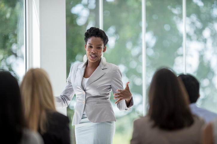 Business woman speaking at an event